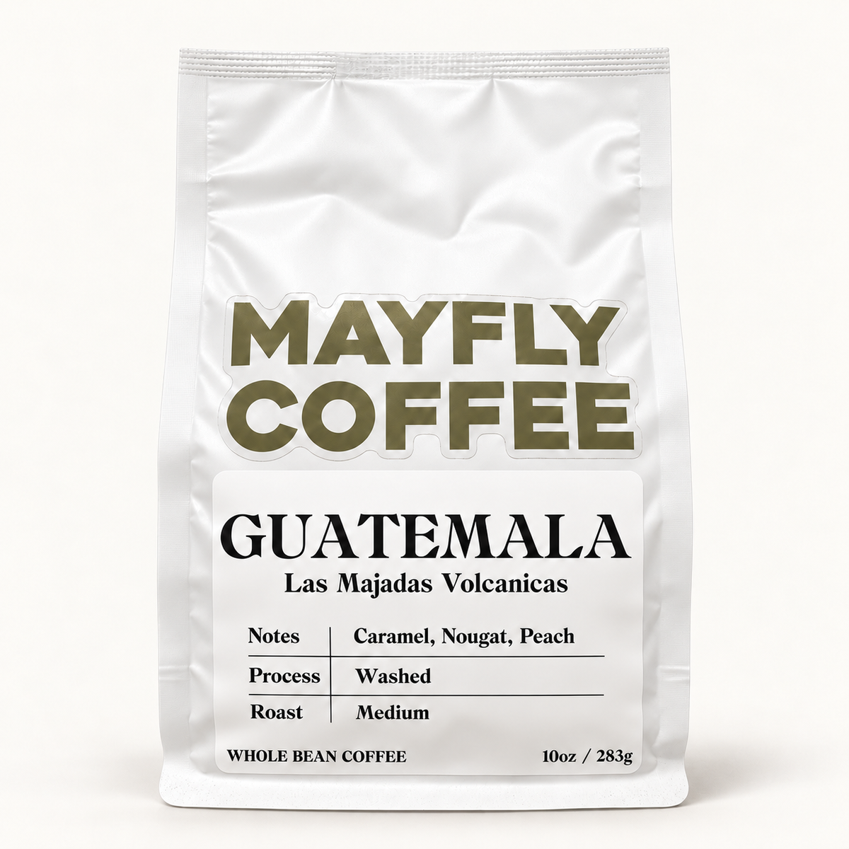 A white stand-up coffee bag labeled MAYFLY COFFEE Guatemala, with black and olive text on a white background.