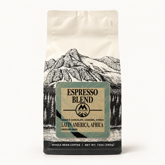 A 12 oz bag of Espresso Blend whole bean coffee from Baker's Chocolate, featuring a cream-colored background with a black line-art mountain illustration and a central greenish label.