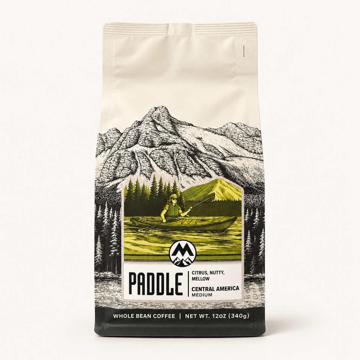 A 12 oz bag of Paddle Coffee, Whole Bean, Medium roast, featuring a cream-colored background with a black and white mountain illustration and a central green and yellow canoe graphic.